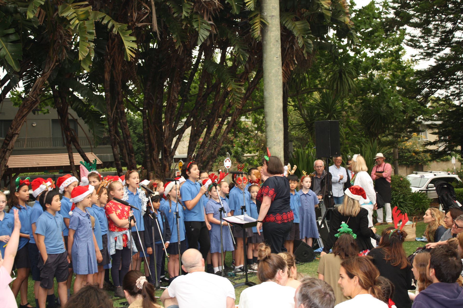 Children singing carols at QSWWA Christmas Carols in Chiswick Park