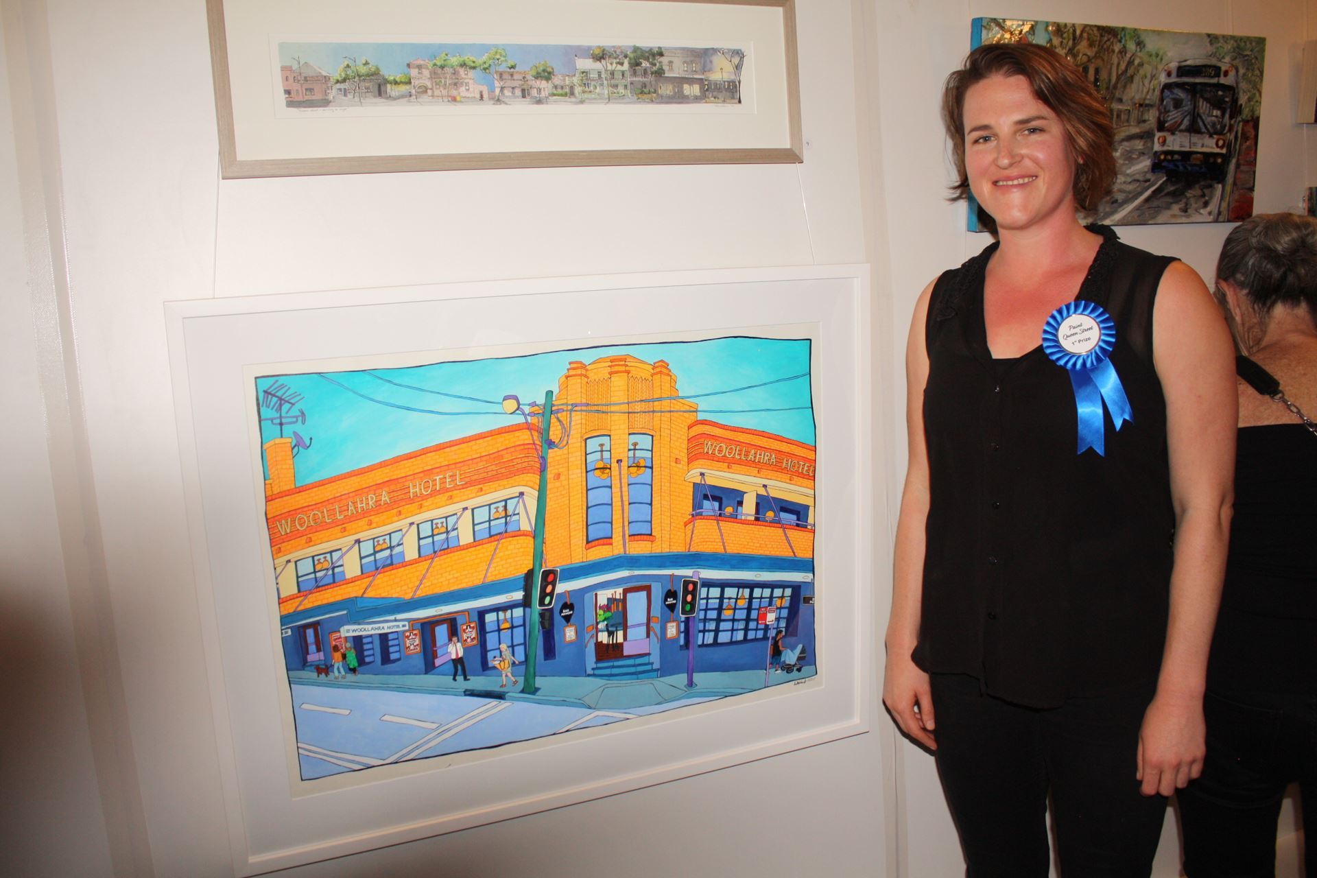QSWWA Paint Queen Street First Prize Winner Frankie Nankivell with her painting ‘Village Corner’ 